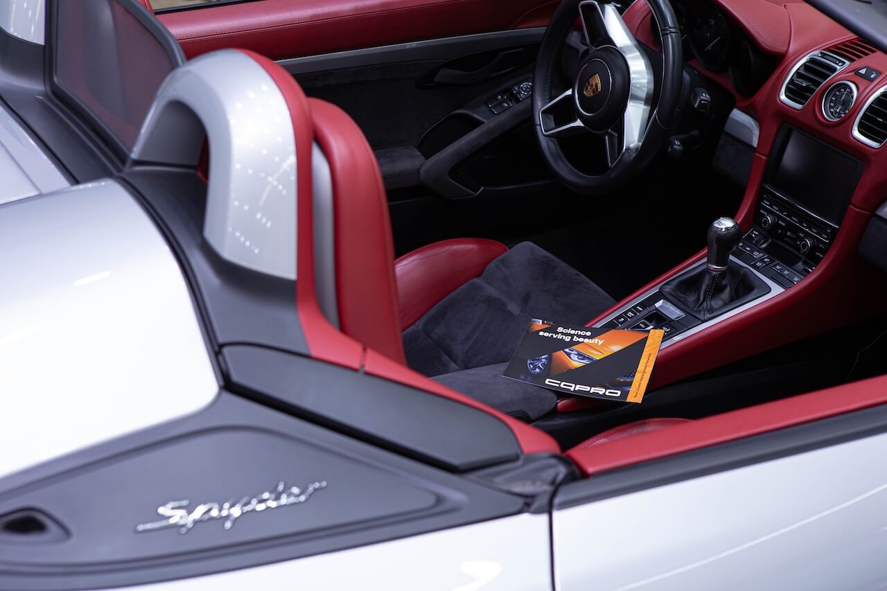 Porsche 718 Spyder red leather interior detailed in Redmond