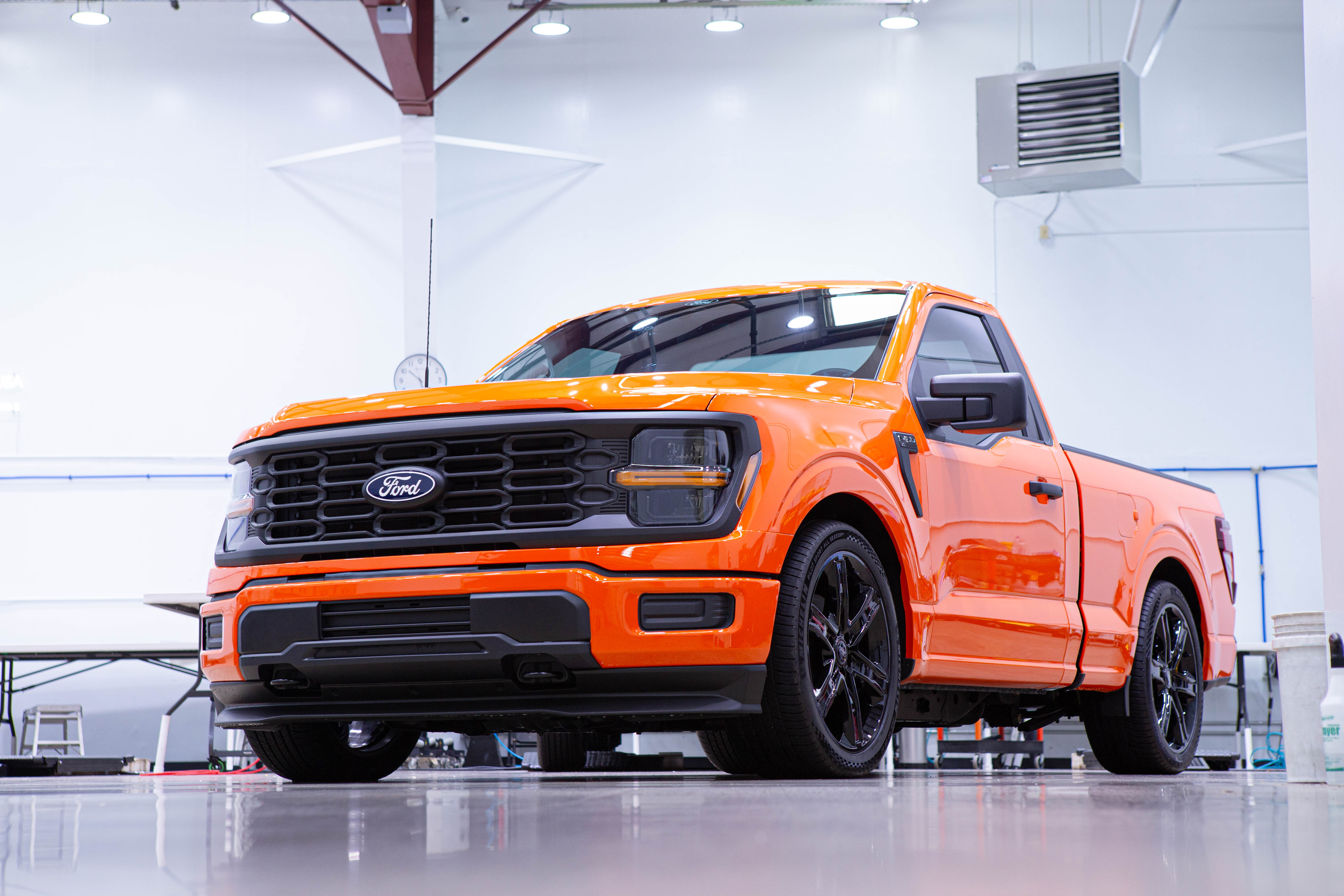 Orange pickup truck, front three quarter