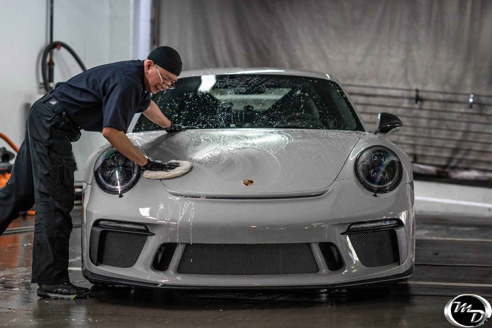 Hand washing a Porsche at Metropolitan Detail Express
