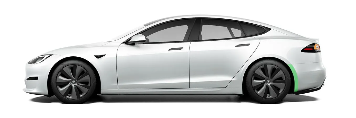 Rear wheel well coverage highlighted on a Tesla Model S